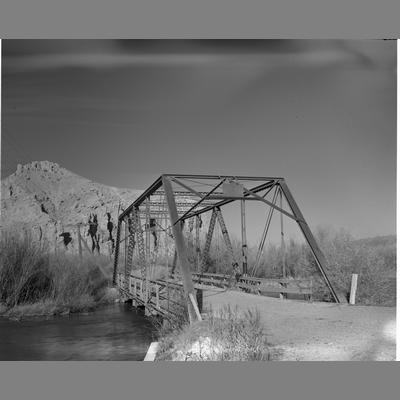 Black and white photo of the Point of Rock Old Bridge crossing the Beaverhead River in Madison County, Montana