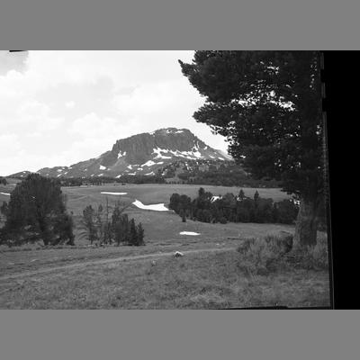 View Looking Across a High Mountain Meadow to a Black Rock Butte