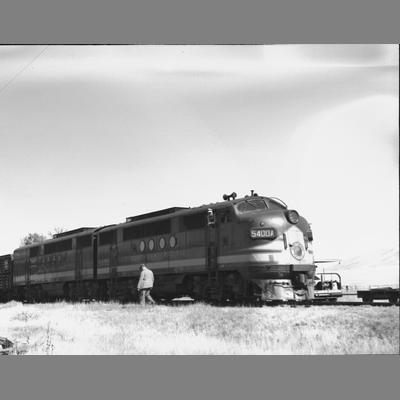 A Man in Front of a Diesel Train in Twin Bridges 1954