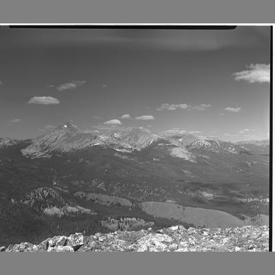 View from the top of a ridge overlooking forests and mountains, Beaverhead County, Montana 1956.
