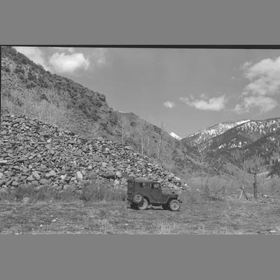 A Jeep Parked in front of a Large Pile of Mine Tailings, 1955