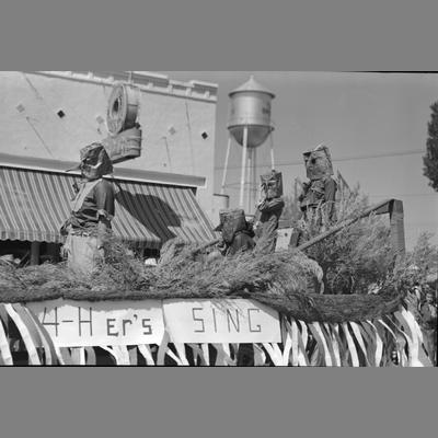 Four People in Costume During Parade on Main Street, Twin Bridges, Montana, August 19, 1956