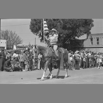 Man in Western Garb Mounted on Horse in Parade on Main Street, Twin Bridges, Montana, August 19, 1956