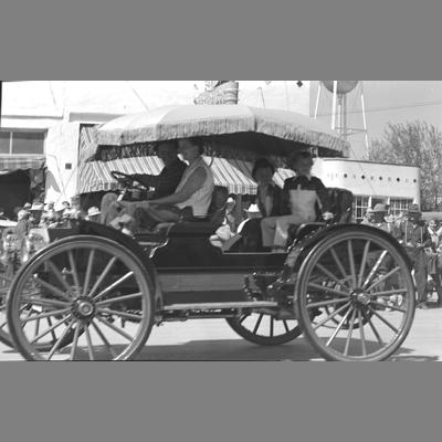 Parade on Main Street with Loyd Harkin's Silverstar 1906 International, August 19, 1956