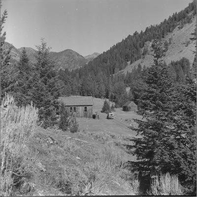 Abandoned Frame Building on Slope Leading Down to a Dirt Road in Nobelville, Wisconsin Creek, October 1960