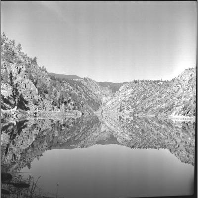 Ennis Lake with Reflective Surface Showing Rocky Sloped Bank October 28, 1952