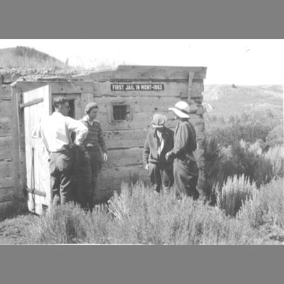 Toursists Gathered Outside the First Jail in Montana Built in 1862