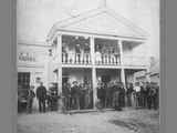 Group of Men on Front Porch of the Bannack Hotel, 1890