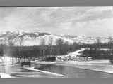 Big Hole metal truss bridge spanning an ice frosted river.