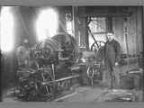 Ruby Lathe Standing Next to Elaborate Belt Driven Machine