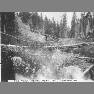 Brushy Mountain Draw with Crude Log Cabin Near Elkhorn Springs 1890