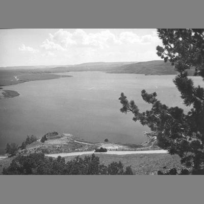 Pickup Truck Parked Along Dirt Road in Front of Ennis Lake