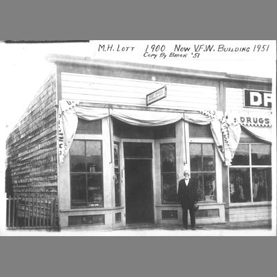 M. H. Lott Standing in Front of Frame Business Building 1900 (Now VFW Building 1951)