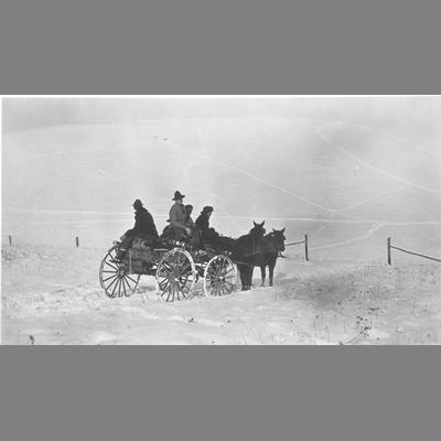 Men Riding in horse-drawn Wagon Observing a Snowy Field with Ski Tracks