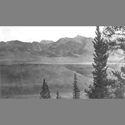 Hilly Valley with Mountains Beyond