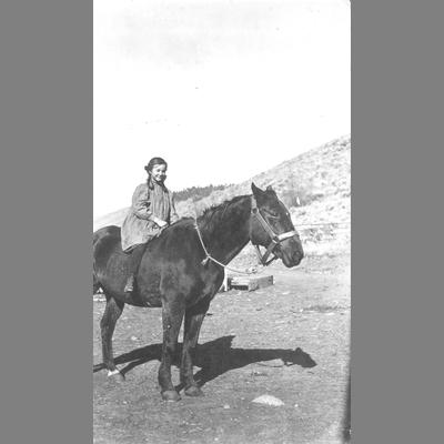 Young Girl Sitting Bareback on a Horse