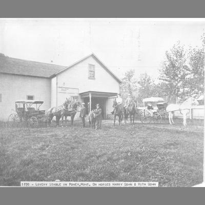 Two Light Buggies in Front of Wood Frame Livery Stable in Pony, Montana 1890