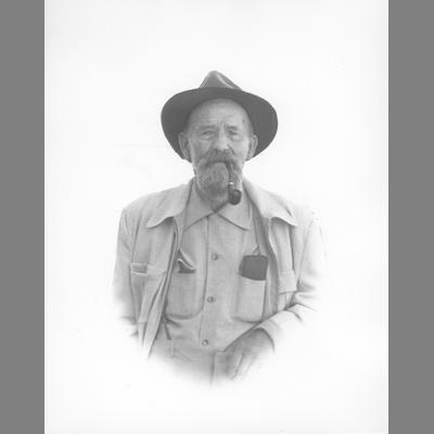 Vignette Portrait of Elderly Bearded Joe Redfern with Pipe Wearing a Hat
