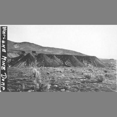 Mine Dump With Dark Piles of Slag in Open Field