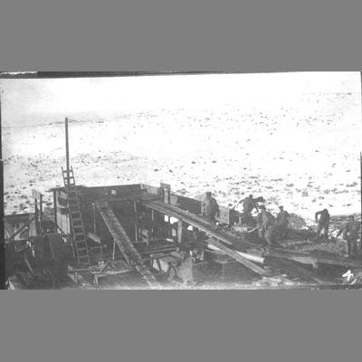 Watseka Mill - Overhead View of Workers Shoveling Ore Wooden Chute circa 1900