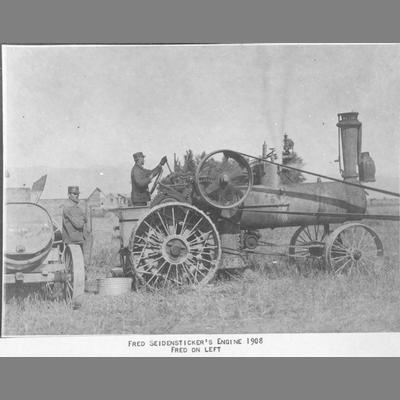 Fred Seidensticker Operates Steam Tractor with Machine Belted Attached, 1908