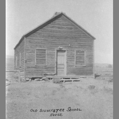 Silverstar School With Boarded Up Windows in an Empty Prairie