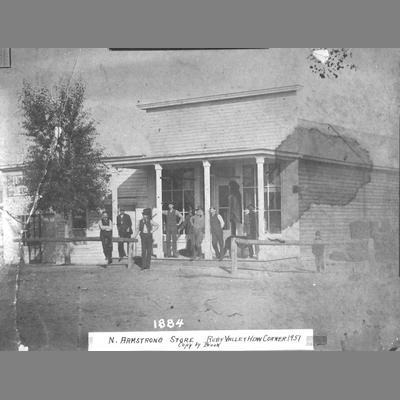 Group of Men Standing in Front of Armstrong Store 1884
