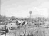 Twin Bridges With Large Water Tank in Center of Town 1920