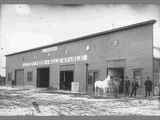 Six Men and White Horse Stand in Front of Anderson Stable circa 1890s