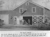 Two Men Stand in Front of Palace Stables 1899