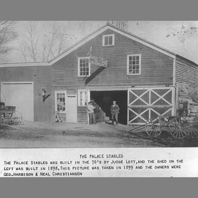 Two Men Stand in Front of Palace Stables 1899