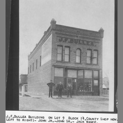 Three Men Standing in front of JF Dullea Building circa 1890