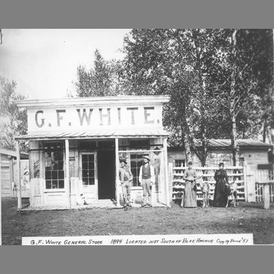 G. F. White General Store With Two Men and Two Women Standing Outside