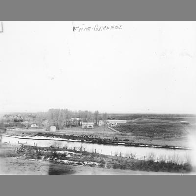 Elevated and Long Distance View of Buildings Positioned Near River 1897
