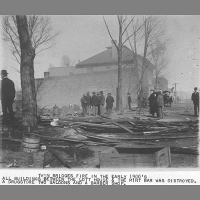 Groups of Men Examine Burned Wreckage of Buildings During Twin Bridges Fire circa 1900