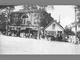 Crowd in Front of Two Story Brick Commerical Building on Reid Block ca. 1920