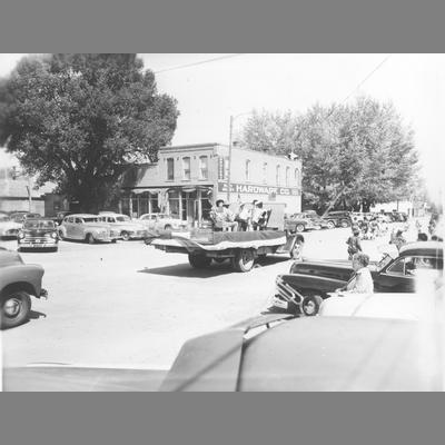 Men and Women Seated in Back of Decorated Flat Bed Truck in Twin Bridges Parade circa 1950