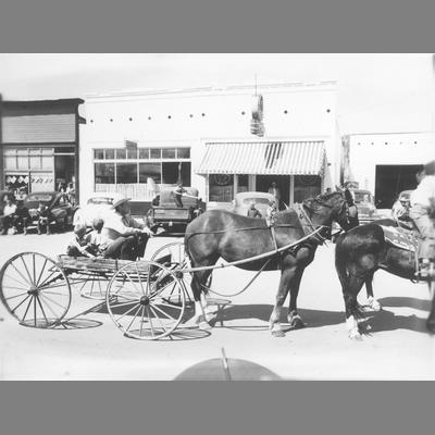 Man and Two Boys Seated in a Horse-Drawn Buggy in Twin Bridges Parade circa 1950
