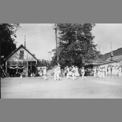 Marching Band in Uniforms Marching on Dirt Road circa 1920