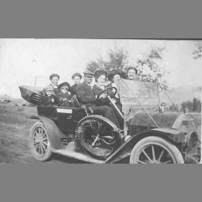 Unidentified Group Riding in Open Automobile Coach