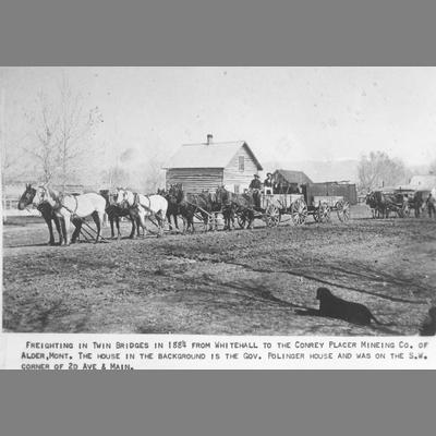 horse-drawn Wagon in Front of Log Buildings in Twin Bridges, 1884