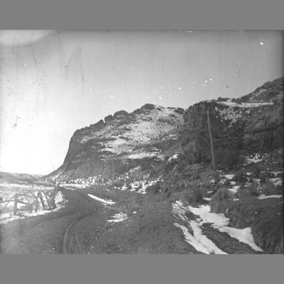View of a Road Running Along the Bottom of a Mountain in Twin Bridges