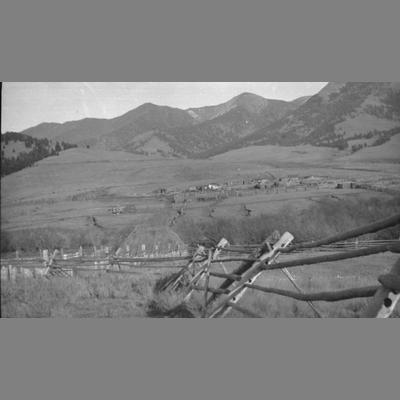 View from a fence of a small ranch.