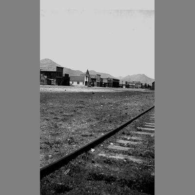 Railroad tracks running through a small town.