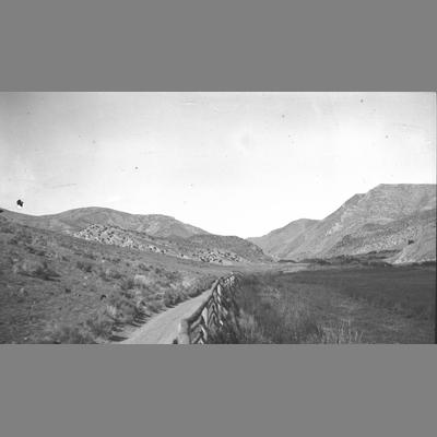 A Dirt Trail Leading Into Mountains