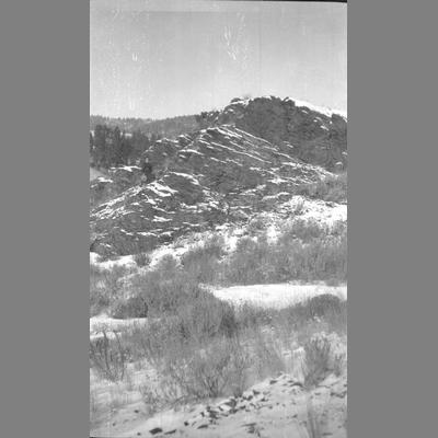View from Below of a Snowy Cliff