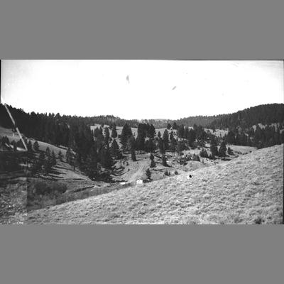 View of an Open Valley With a Residence in the Distance