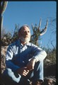 Ivan Doig sitting on rock in desert