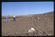 Ivan Doig and John Maata touring rock field in the Sweet Grass Hills of Montana