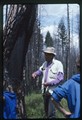 Glacier National Park - Jerry DeSanto standing near burned tree